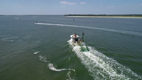 following fishing boat with drone in fernandina beach florida near amelia island florida possibly a fishing boat