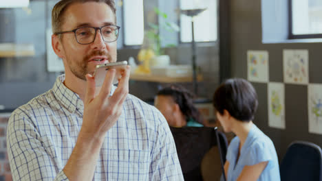 Businessman-talking-on-mobile-phone-in-office-4k