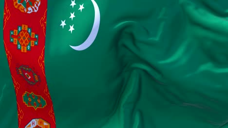 turkmenistan waving in wind slow motion animation . 4k realistic fabric texture flag smooth blowing on a windy day continuous seamless loop background.