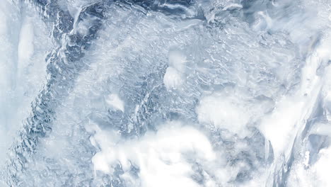 water flowing under transparent ice surface. ice background. ice pattern