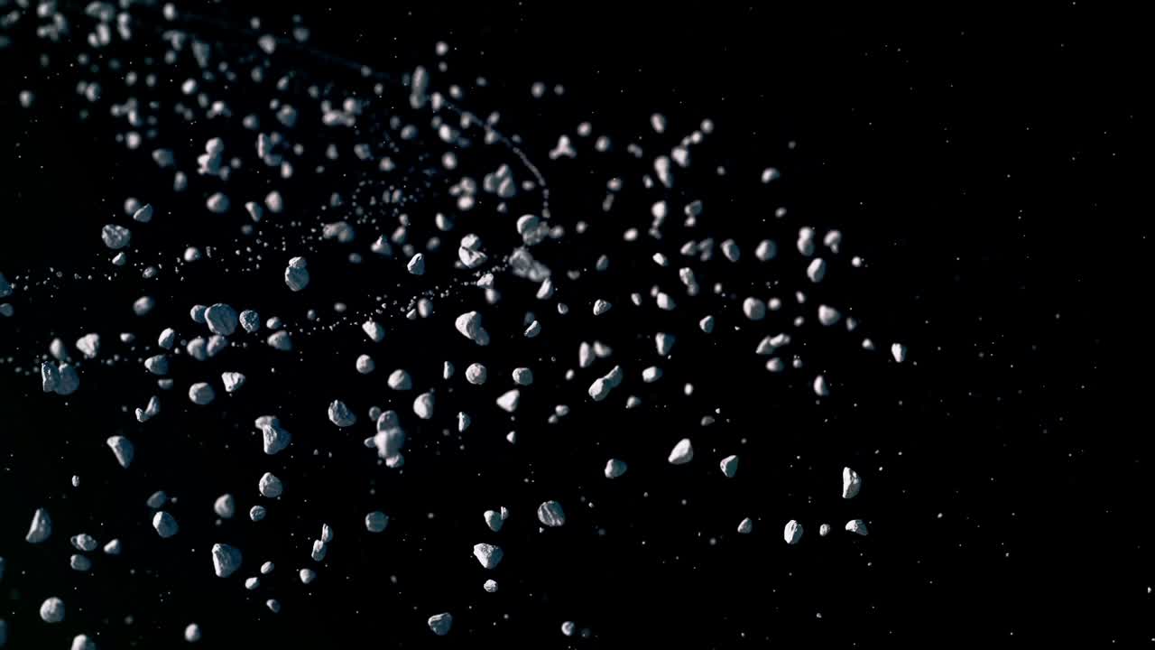 Field of numerous asteroids slowly drifting and rotating in deep space. Sci-fi, astronomy, cosmic rocks, asteroid belt animation, exploration