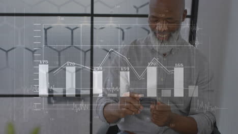 animation of diagrams and data processing over biracial businessman using smartphone