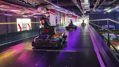 indoor go-karting track with people