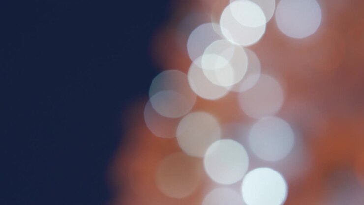 Blurred white Christmas tree lights and decoration bokeh background.