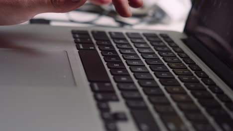 Male-Hand-Business-Professional-Typing-on-Laptop-Keyboard-Working-from-Home