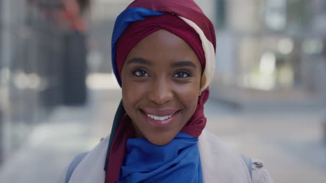 portrait young african american business woman laughing enjoying successful urban lifestyle beautiful black muslim female wearing traditional hijab headscarf in city