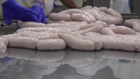 a sausage is a cylindrical meat product usually made from ground meat, often pork, beef, or veal, along with salt, spices and other flavourings, and breadcrumbs, encased by a skin
