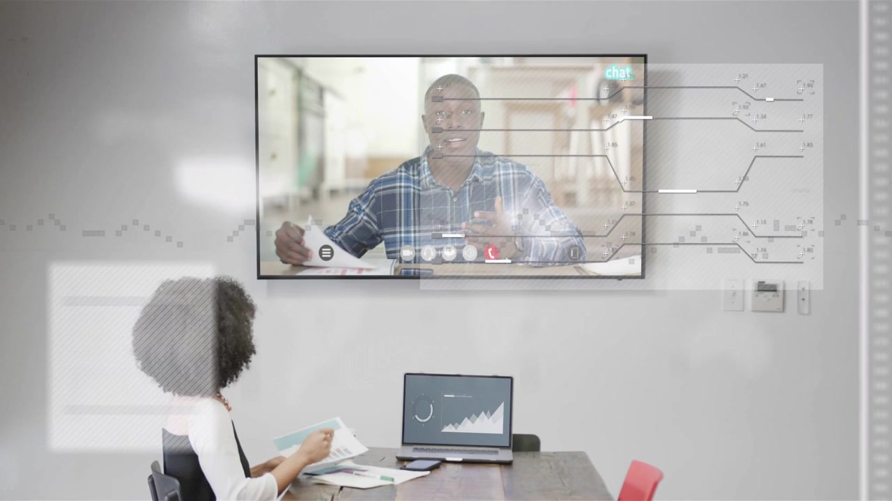 Woman tapping laptop with rising graph as presenter on screen talking and causing business overlays