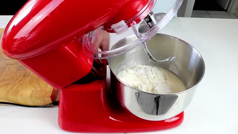 putting dough mixer bowl into the machine