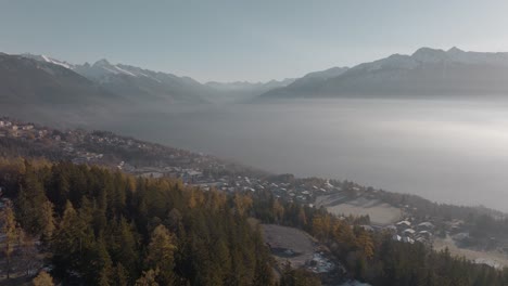 Wide-rotating-Aerial-of-mountain-town-Crans-Montana-in-European-Alps,-Switzerland