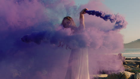 woman-dancing-with-purple-smoke-grenade-on-beach-celebrating-creative-expression-with-playful-dance-in-slow-motion