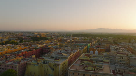 Blocks-of-colour-apartment-buildings-in-urban-borough-in-morning-city.-Aerial-view-against-sunrise.-Rome,-Italy