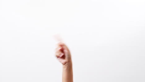 close up of a woman making gestures with one arm with touching on a white studio background with copy space for placing a text for an advertisement