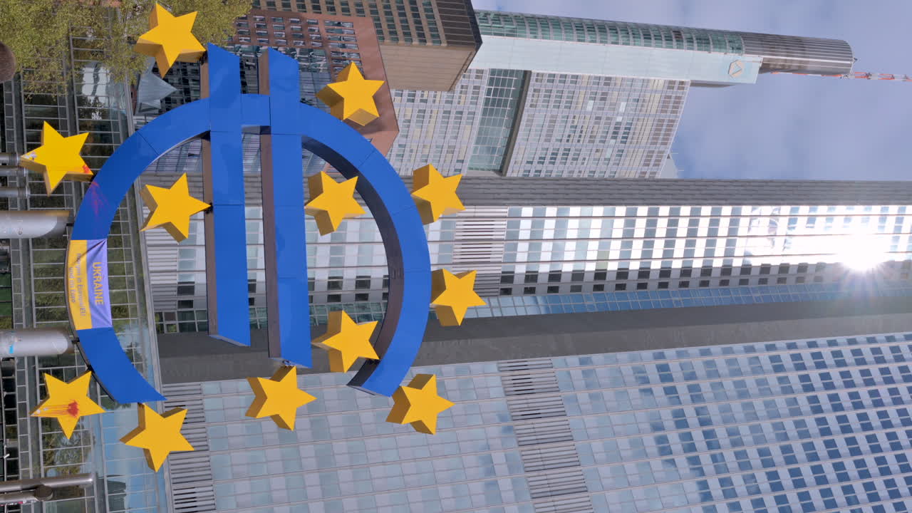 Frankfurt, Germany - 14 September, 2022: Blue euro sign in front of the European Central Bank. Vertical