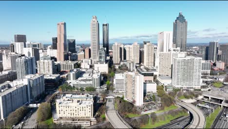 drone shot revealing georgia skyscrapers, hotel district skyline buildings, downtown atlanta, usa