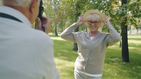 senior couple enjoying a photo shoot in the park