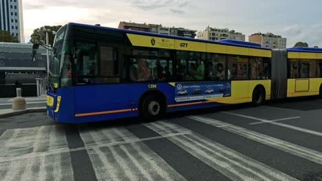 buses and cars navigate a bustling naples street