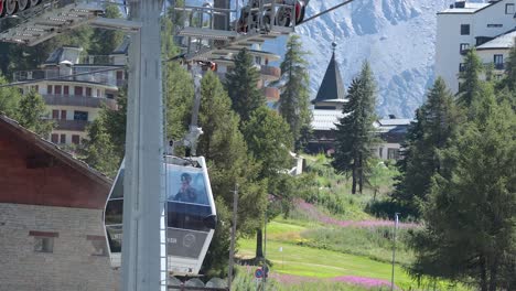 cable car ascending in scenic mountain landscape