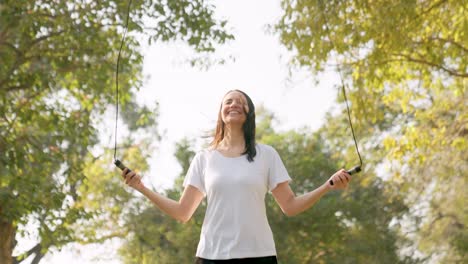 Indian-woman-skipping-rope-in-a-park-in-morning-as-her-exercise-routine