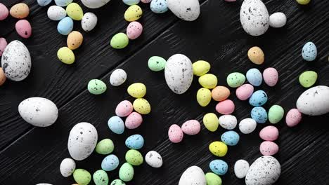 Easter-holidays-concept--Colorful-different-kinds-of-eggs-placed-on-black-wood