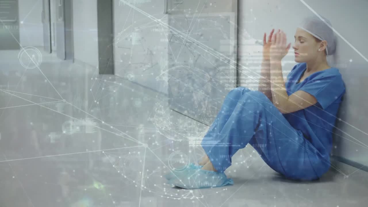 병원 바닥에 앉아있는 지친 여성 의사 위에 지구와 연결된 점의 애니메이션