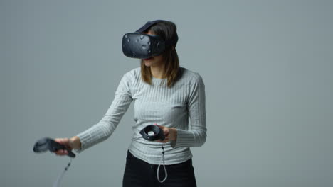 woman wearing virtual reality headset in studio shot on r3d