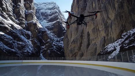 drone flying over a frozen ice rink in the mountains