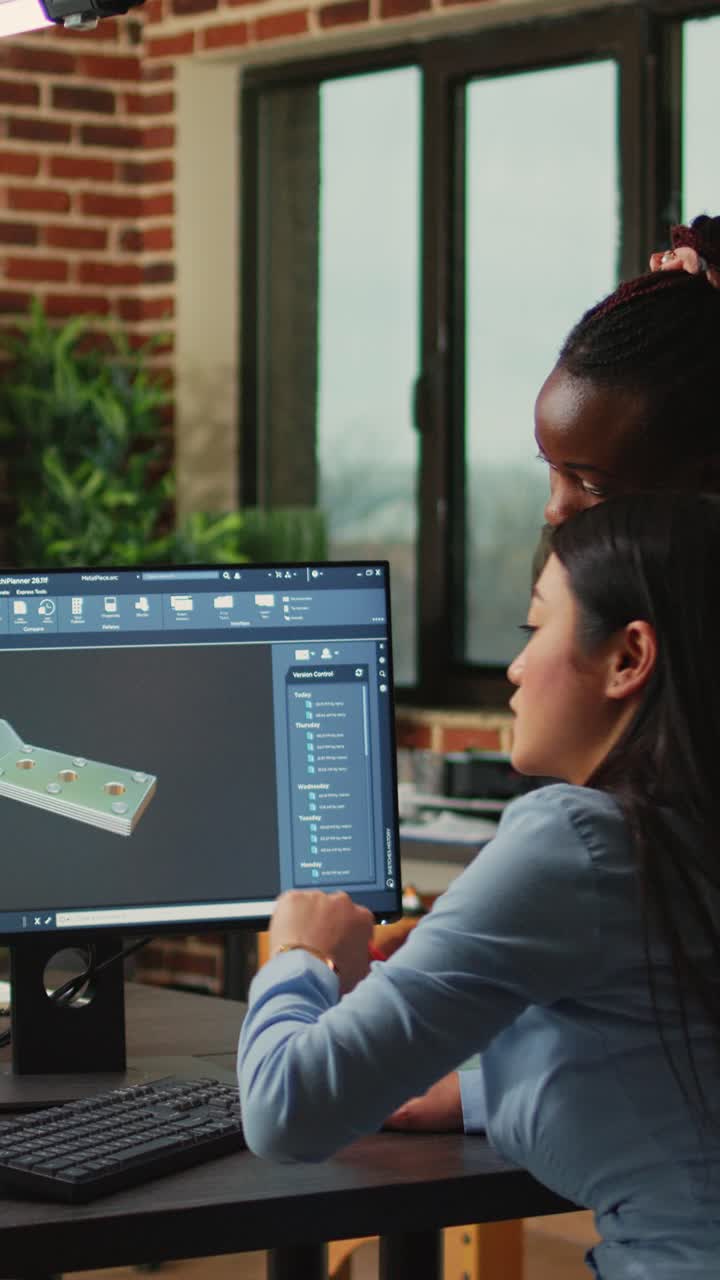 Vertical video: Creative agency diverse team editing video footage using color grading