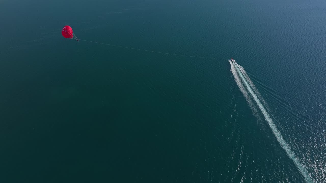 Bird’s-eye view of parasailing above scenic islands and peaks in Fethiye
