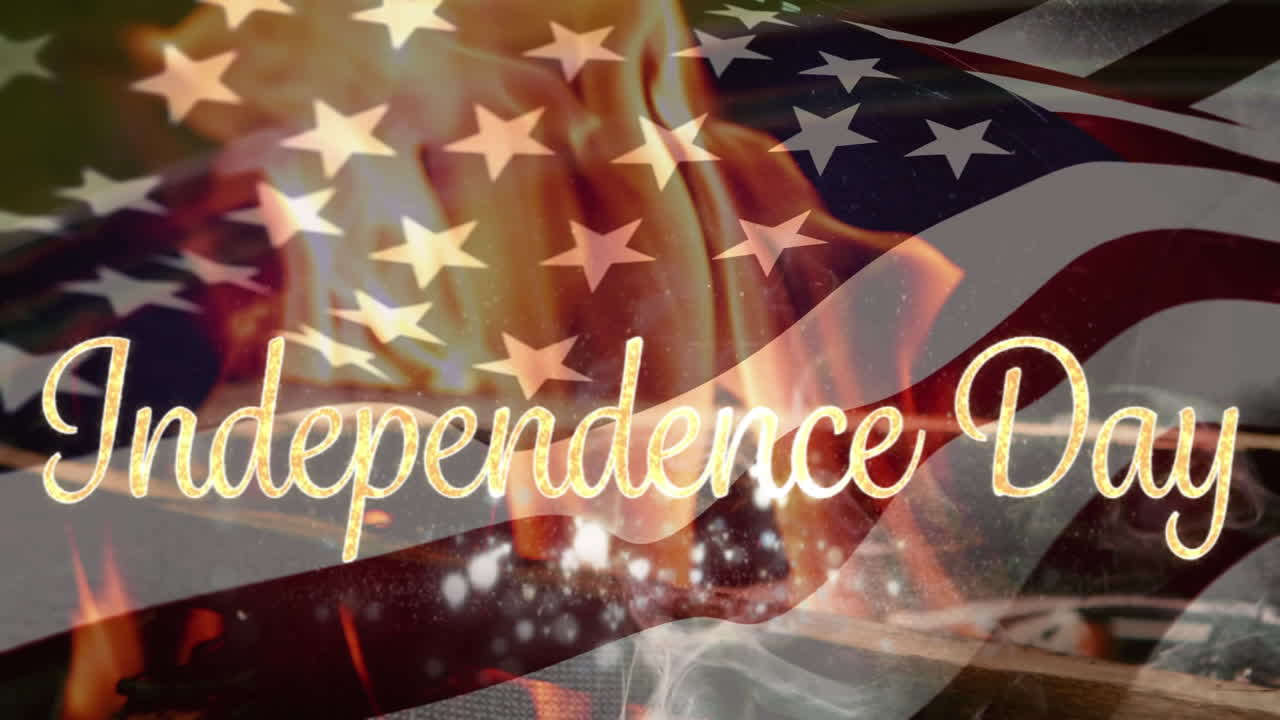 Independence day text with flag and fire burning
