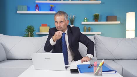 Home-office-worker-man-looking-at-camera-with-a-stern-angry-warning.