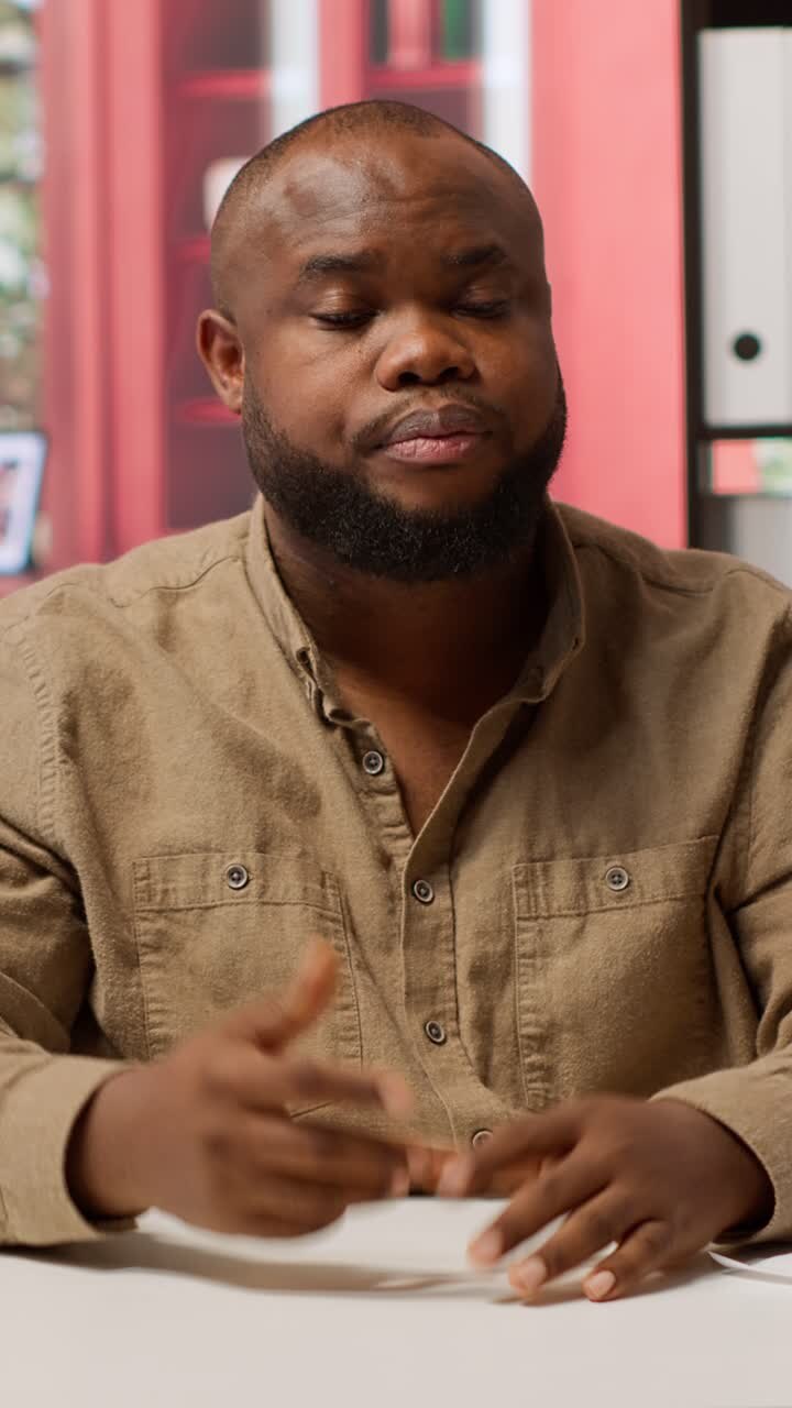 African American Man Talking and Gesturing During Video Call