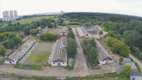 abandoned farmland in urban area with demolition and development in progress