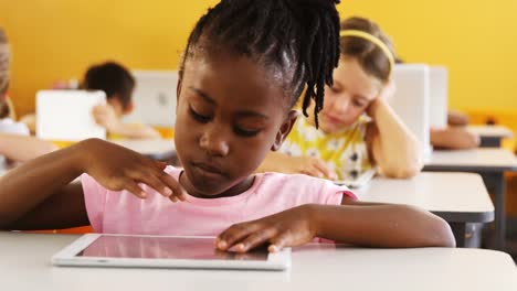 Girl-using-digital-tablet-in-classroom