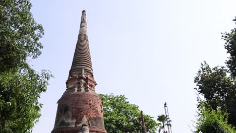 slow pan across a historic pagoda and trees.