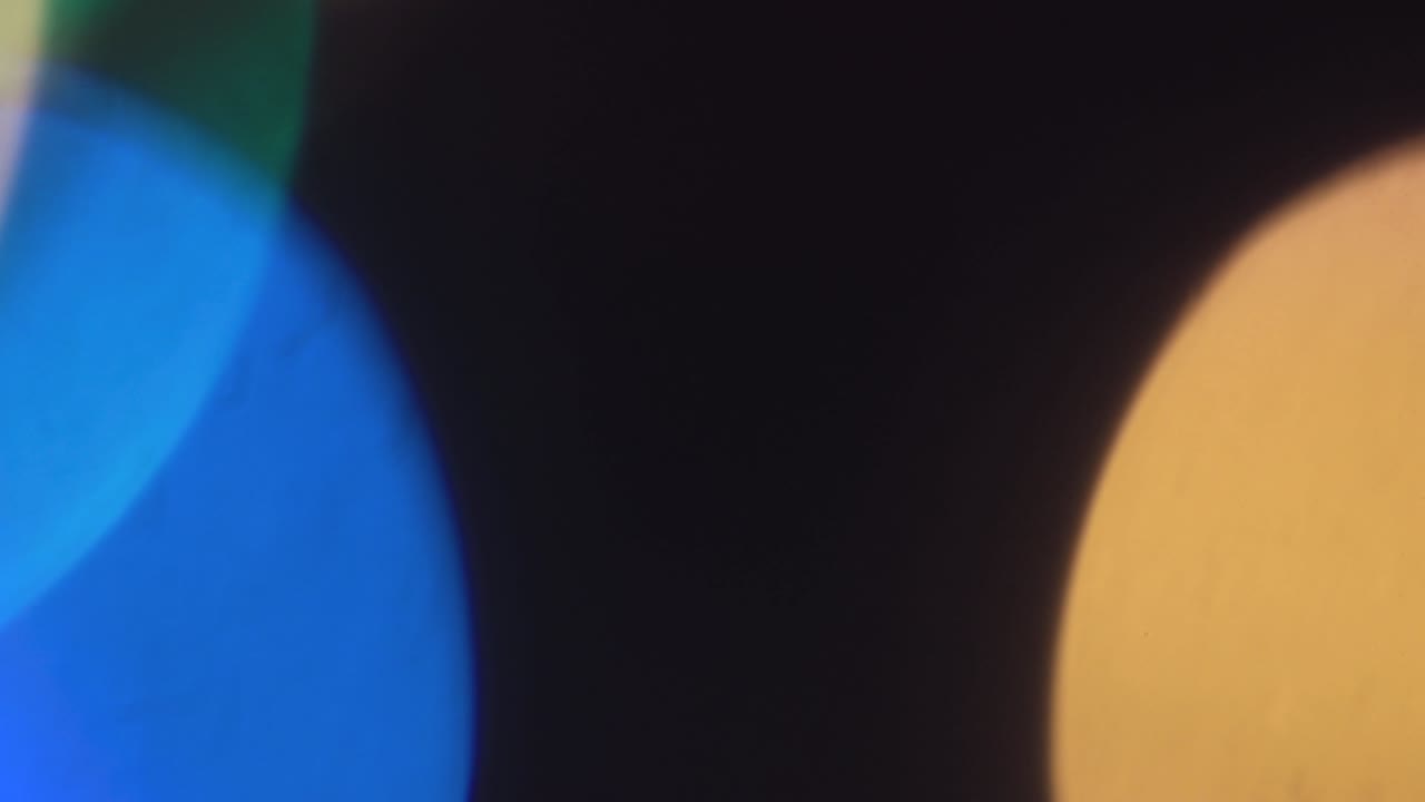 Blurred Christmas mystical colored lights are burning brightly.