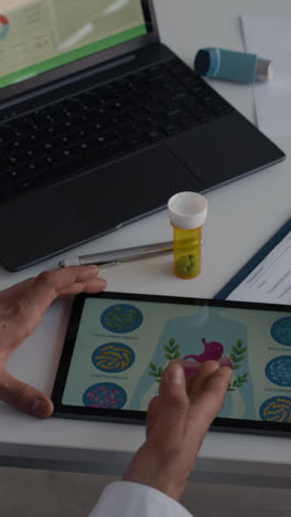 medical workspace with tablet and medication