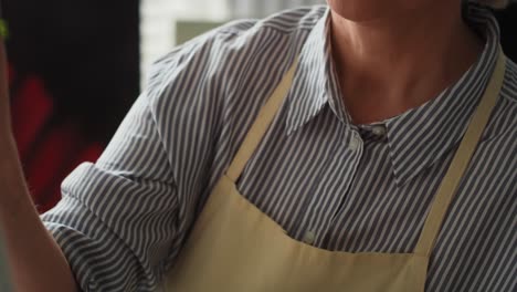 close up video of senior woman painting a picture