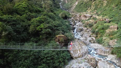 Young-traveler-on-swing-bridge