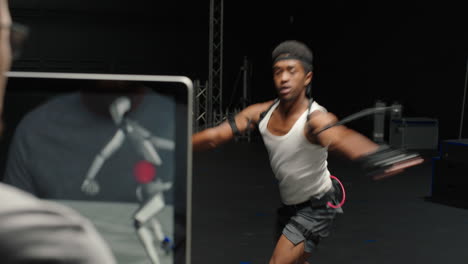 dancing man wearing motion capture suit in studio actor wearing mo-cap suit for 3d character animation for virtual reality technology