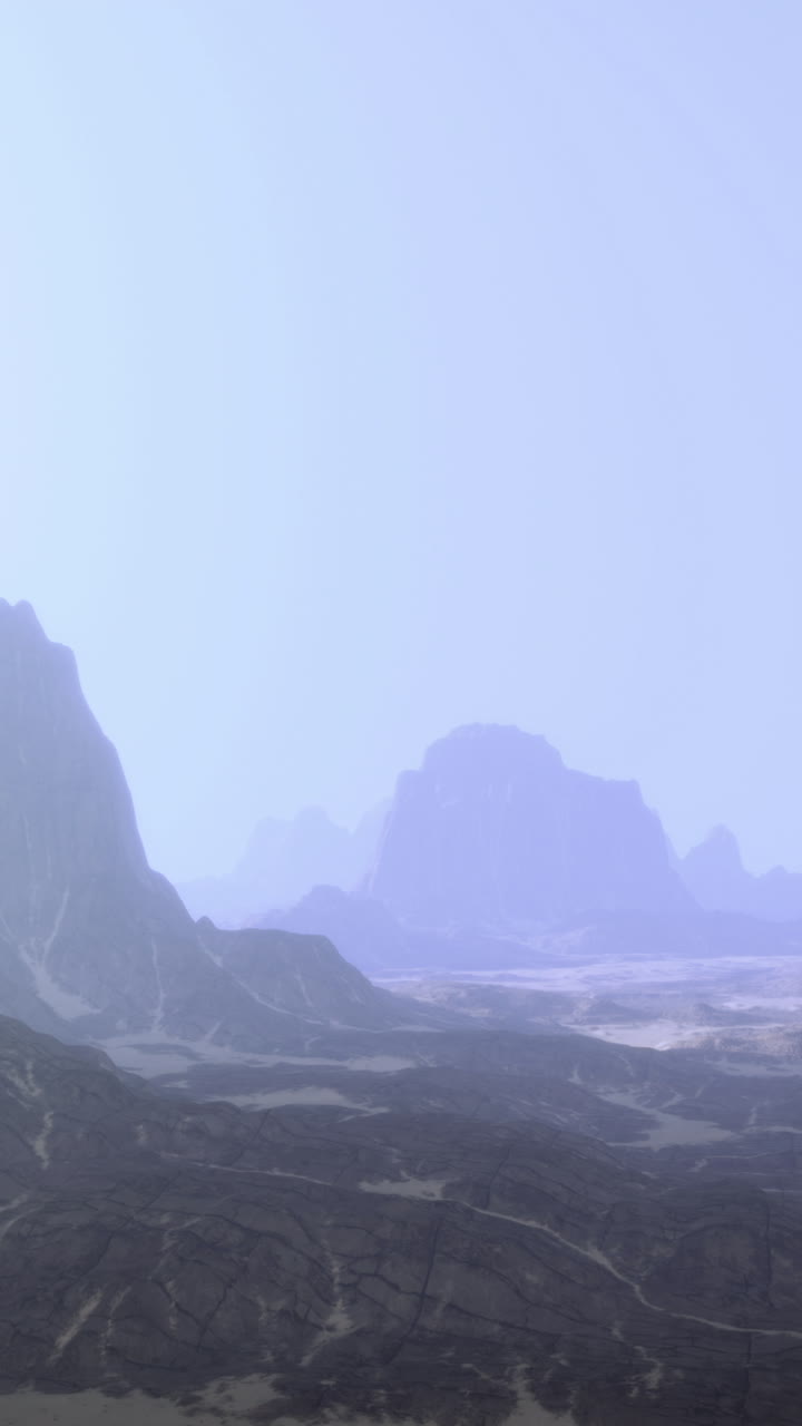 Expansive desert landscape with distant mountains under soft daylight