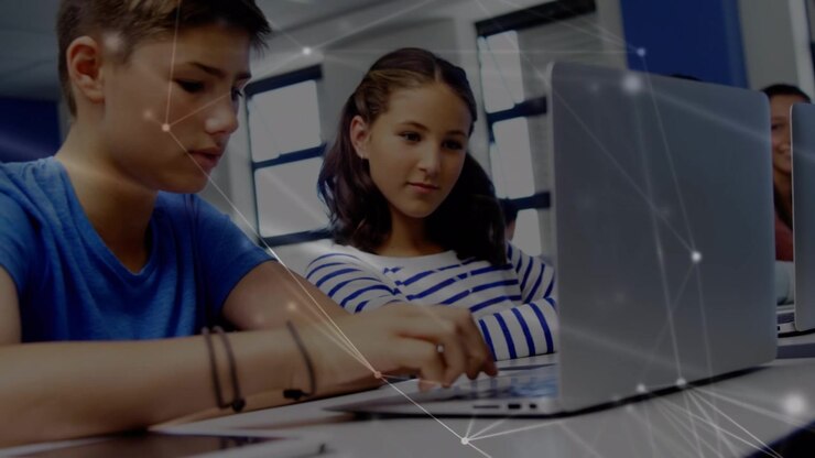 Students Collaborating on a Laptop in a Classroom