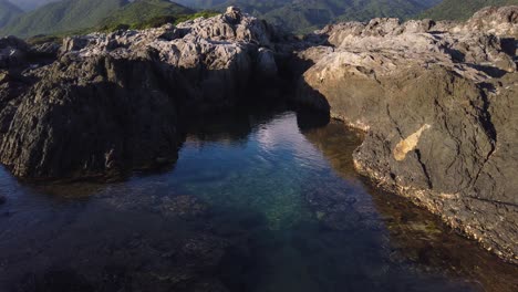 yakushima island, japan. sunrise over tsukasaki tide pools