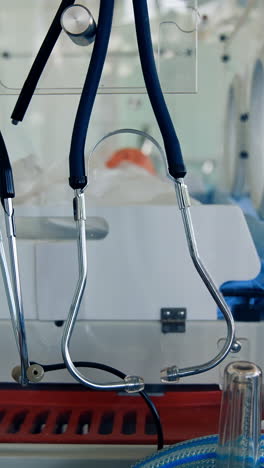 medical mannequin on bed. practicing with medical simulation mannequin in hospital. doll in incubation department concept. vertical video