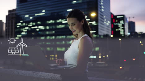 woman working on laptop in city at night, with renewable energy icons.