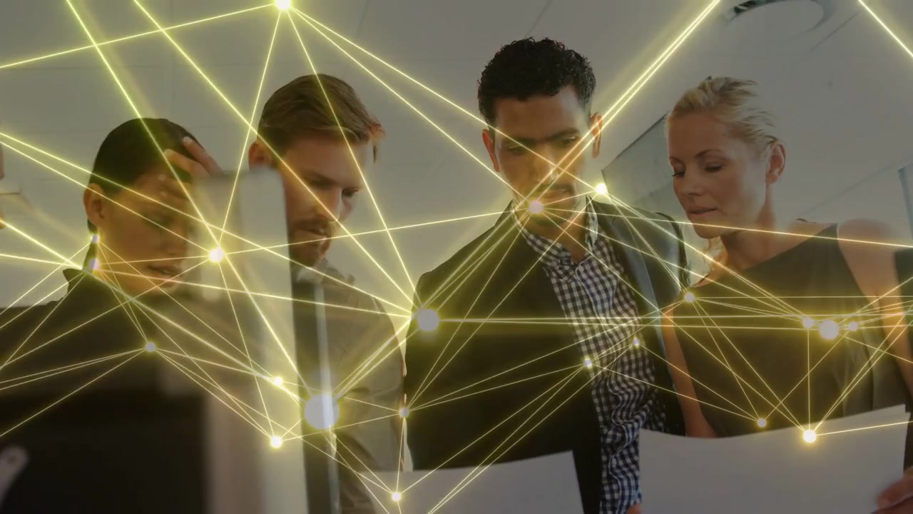5-person group at monitor, lead man holding docs starting business review animated overlay sweeping