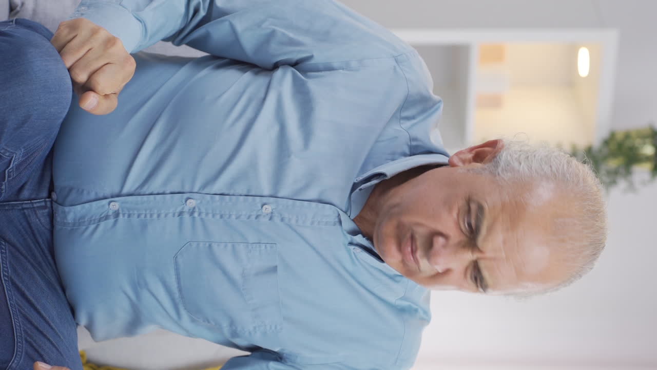 Vertical video of Aggressive and neurotic old man.