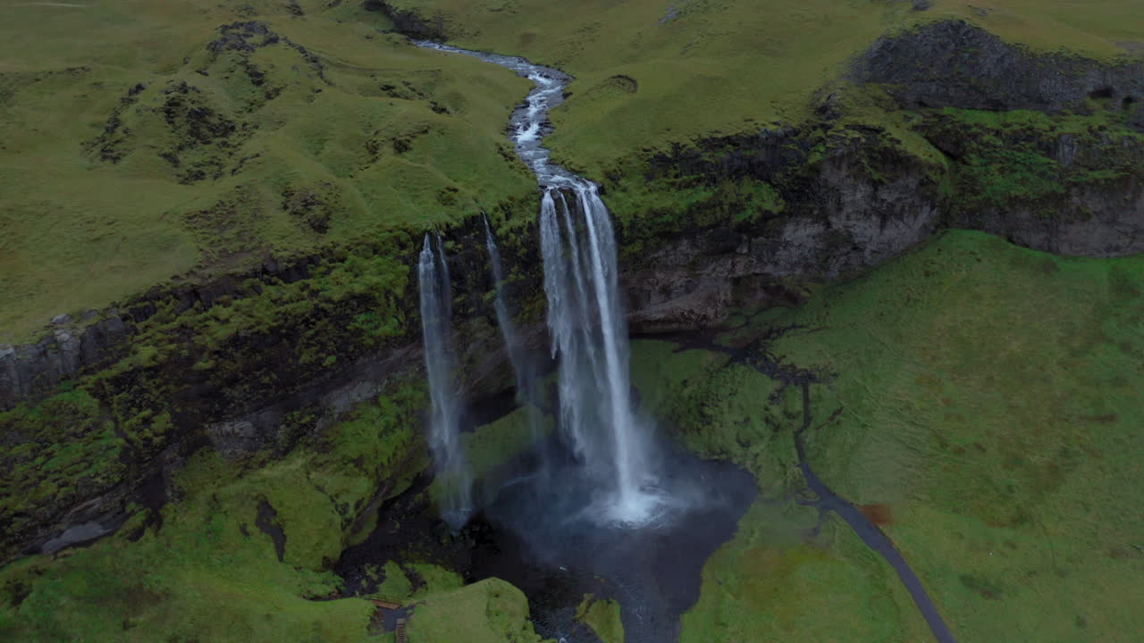 Aerial view of Seljalandsfoss waterfall in Iceland during a cloudy day