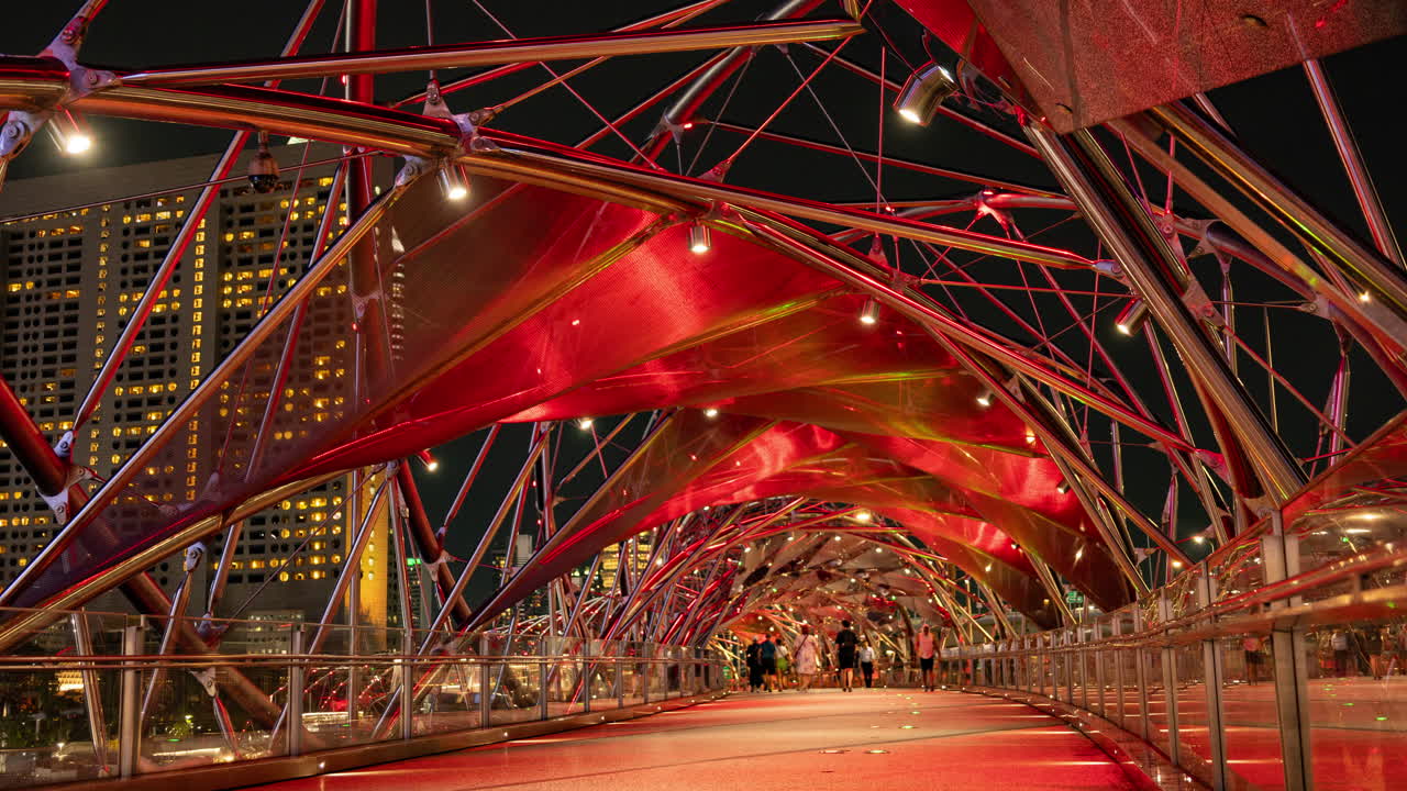 SINGAPORE - 5 MARCH 2025 : timelapse of the helix foot bridge in singapore marina bay at night