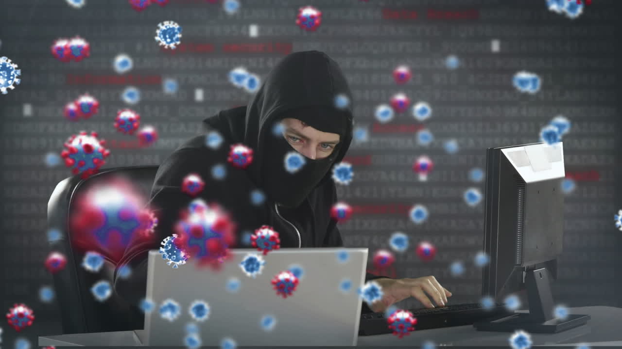 animazione di macro cellule di covid19 su un uomo che indossa una balaclava, usando un portatile